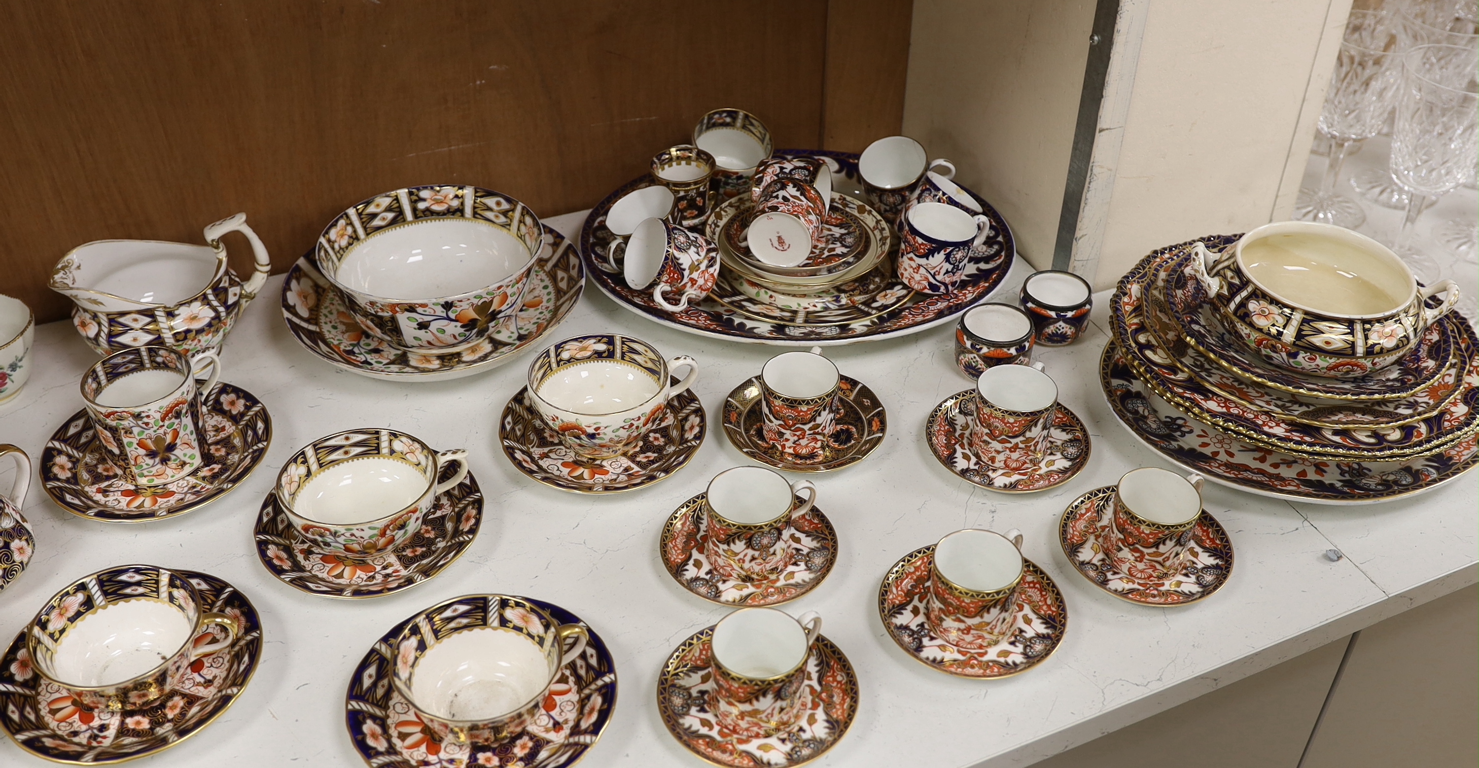 A Collection of Bloor period to Royal Crown Derby Imari pattern dinner and tea ware including dinner plates, cup and saucers and jugs, etc. largest 26cm in diameter